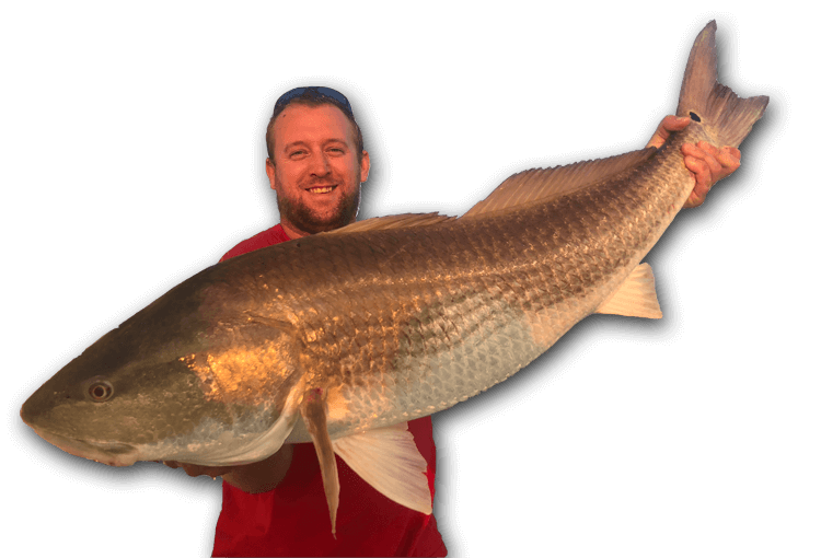 An image of an angler holding a freshly caught monster redfish on a tidewater charter.