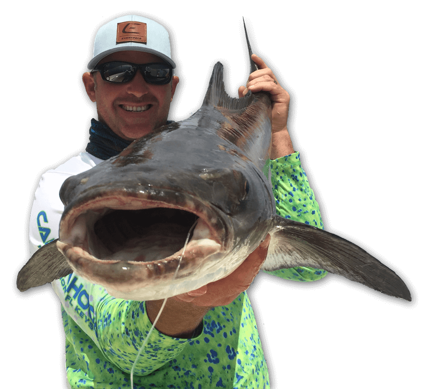 An image of an angler with a cobia caught on a Tidewater Charters adventure in the Florida Keys.