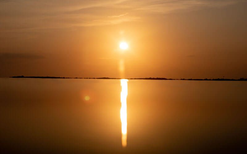 An image of an amazing sunset over the Chesapeake Bay that is the featured image of the Chesapeake Sunset Cruises service.