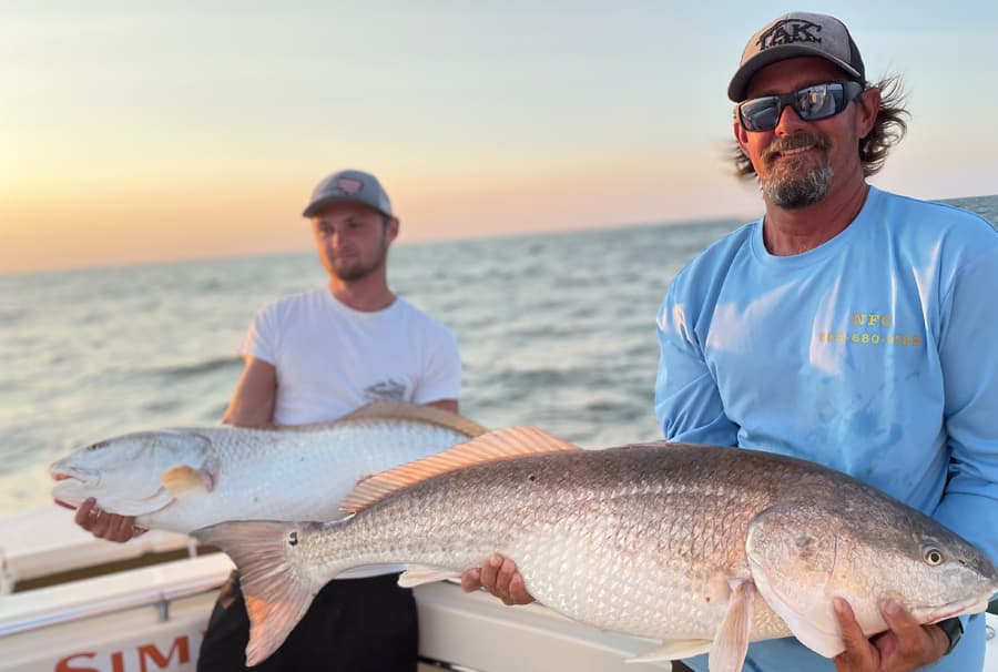 An image of anglers on Tidewater Charters catching Bull Red Drum